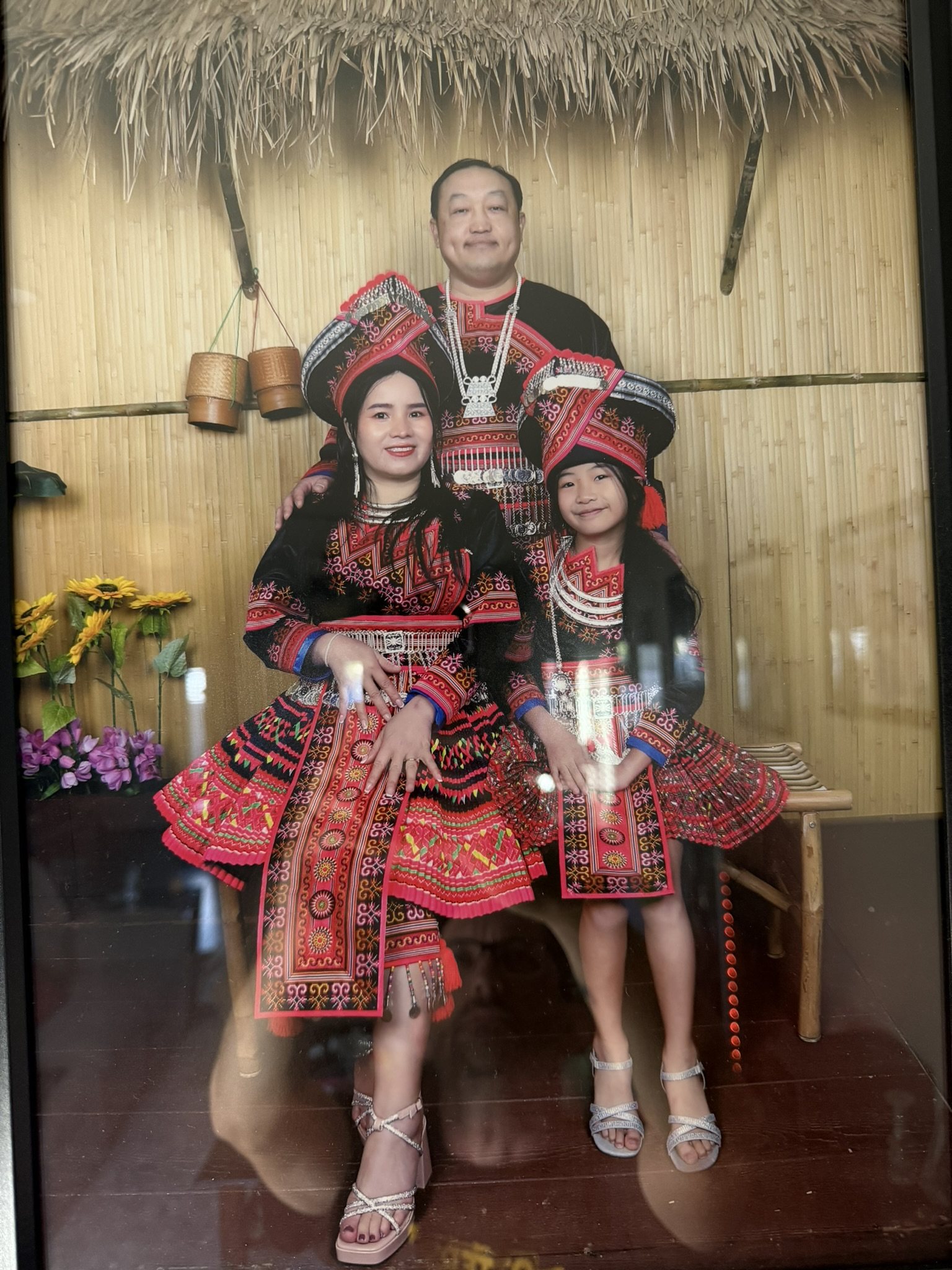 Neng and Kanya with their family in traditional clothing